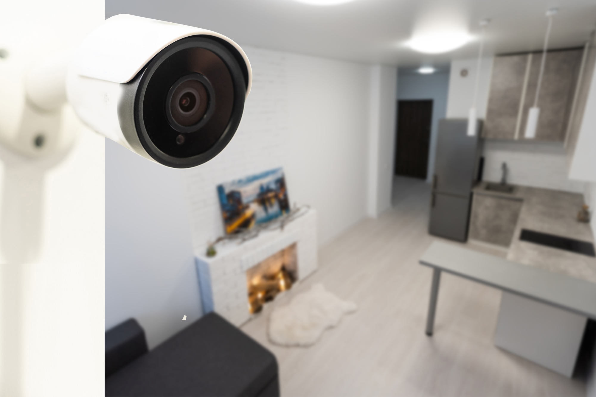 Close Up Object Shot of a Modern Wi-Fi Surveillance Camera on a White Wall in a Cozy Apartment Has